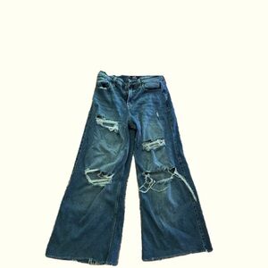 Ripped wide leg blue jeans.